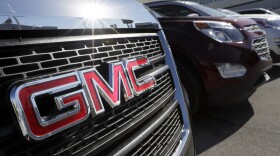 In this April 25, 2017, photo, a GMC truck sits in a General Motors dealer's lot in Nashville, Tenn. (AP Photo/Mark Humphrey)
