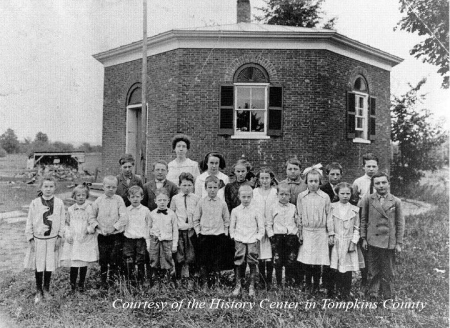 Teacher and Students in front of the one room school house in Dryden, NY.