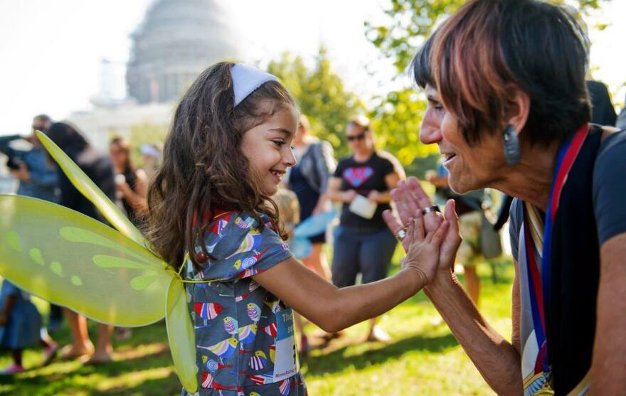 U.S. Rep. Rosa DeLauro, D-Conn. with a child in Washington, D.C.