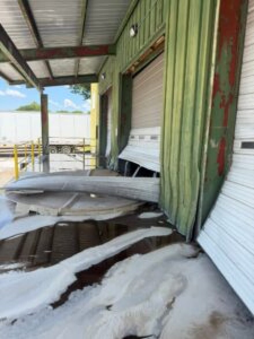 Spilled acid damaged the bay doors at the C&S Chemicals facility in Fort Smith, Arkansas, on May 2, 2026.