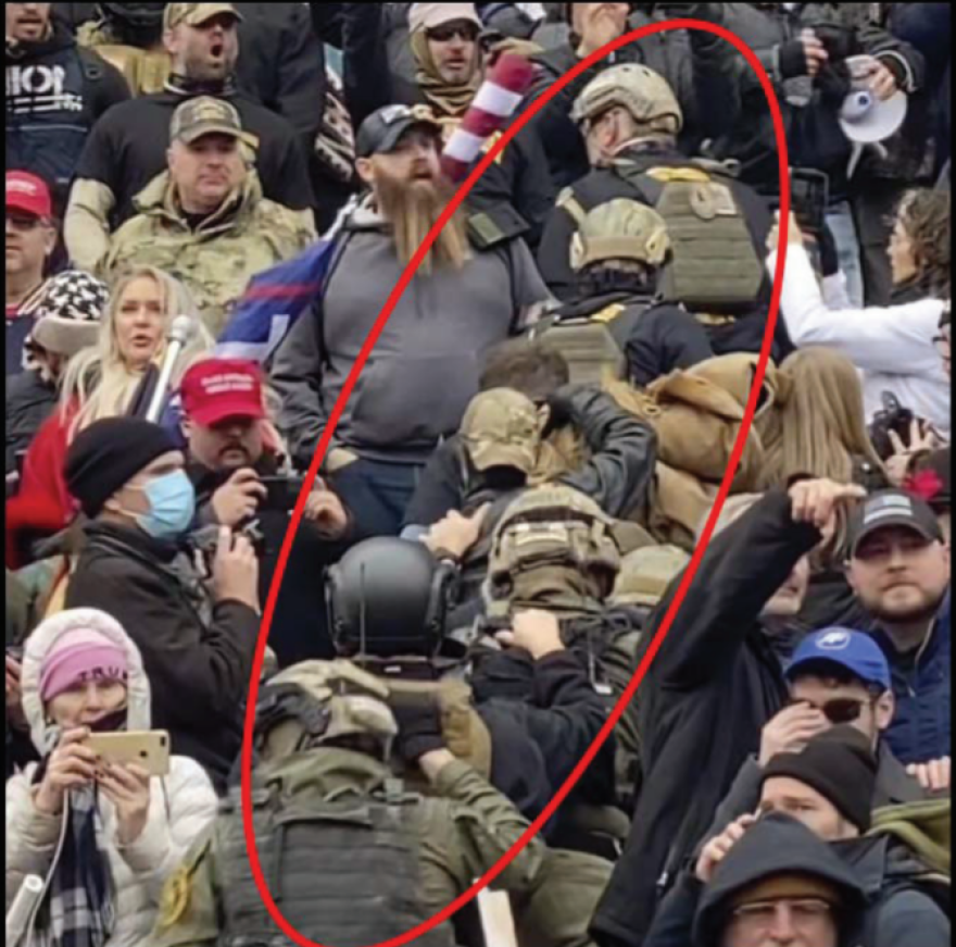 This altered image provided by the FBI shows members of the Oath Keepers in a "stack" formation on the U.S. Capitol steps on Jan. 6. 