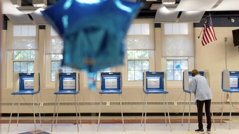 An individual fills out their ballot.