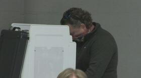 man in voting booth