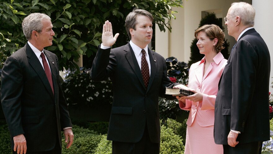 Brett Kavanaugh is sworn in by Kennedy to be a judge on the U.S. Circuit Court of Appeals in 2006. With him are his wife, Ashley, and President George W. Bush.