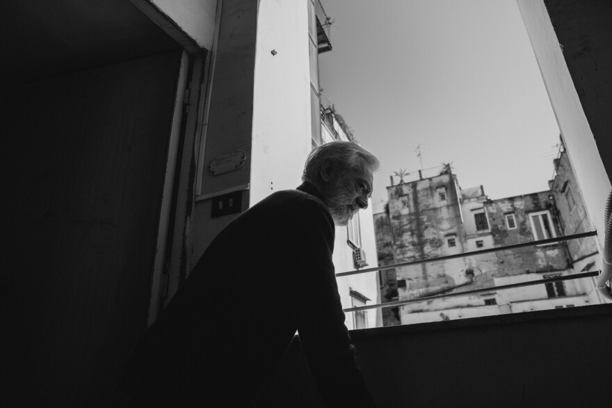 Mimmo, Cipriano's father-in-law, steps outside his entrance door to accept groceries. Because of his weakened immune system, he's hasn't ventured out since the first week of March.