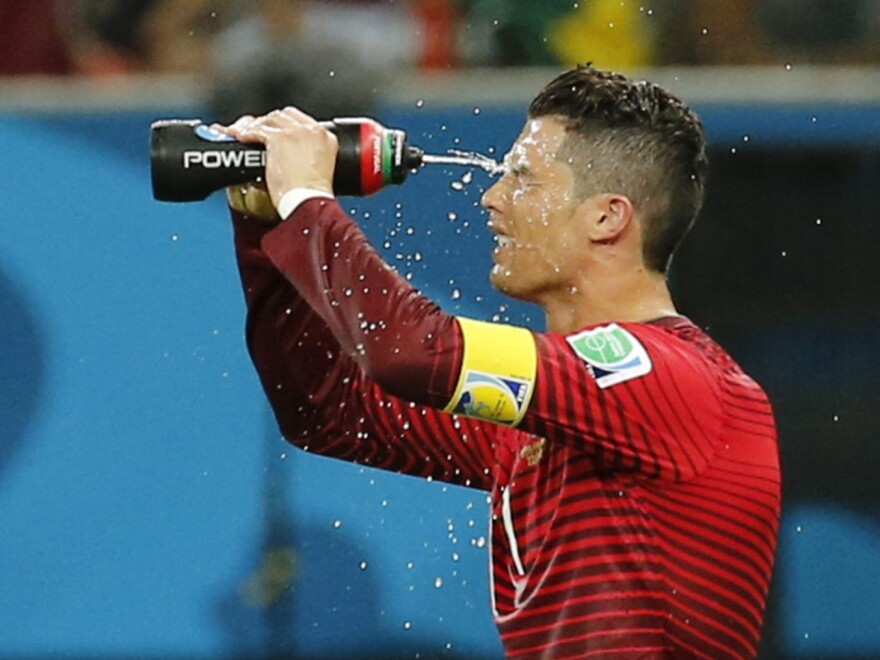 Portugal's Cristiano Ronaldo takes a water break during the 2014 World Cup soccer match between Portugal and the U.S. in Manaus, Brazil, on June 22.