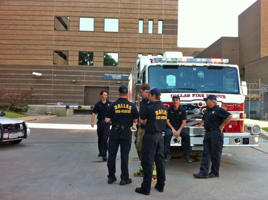 Dallas Fire Rescue Haz Mat crew wraps up call about suspicious white powder at the Crowley Courts building.