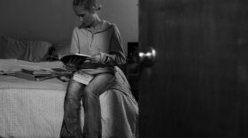 Taylyr Williams, 27, sits on her bed in Oxford House Elmhurst in Norman, where she has lived since January. Williams is one of only 40 Oxford House residents statewide taking medication prescribed to treat opioid addiction.