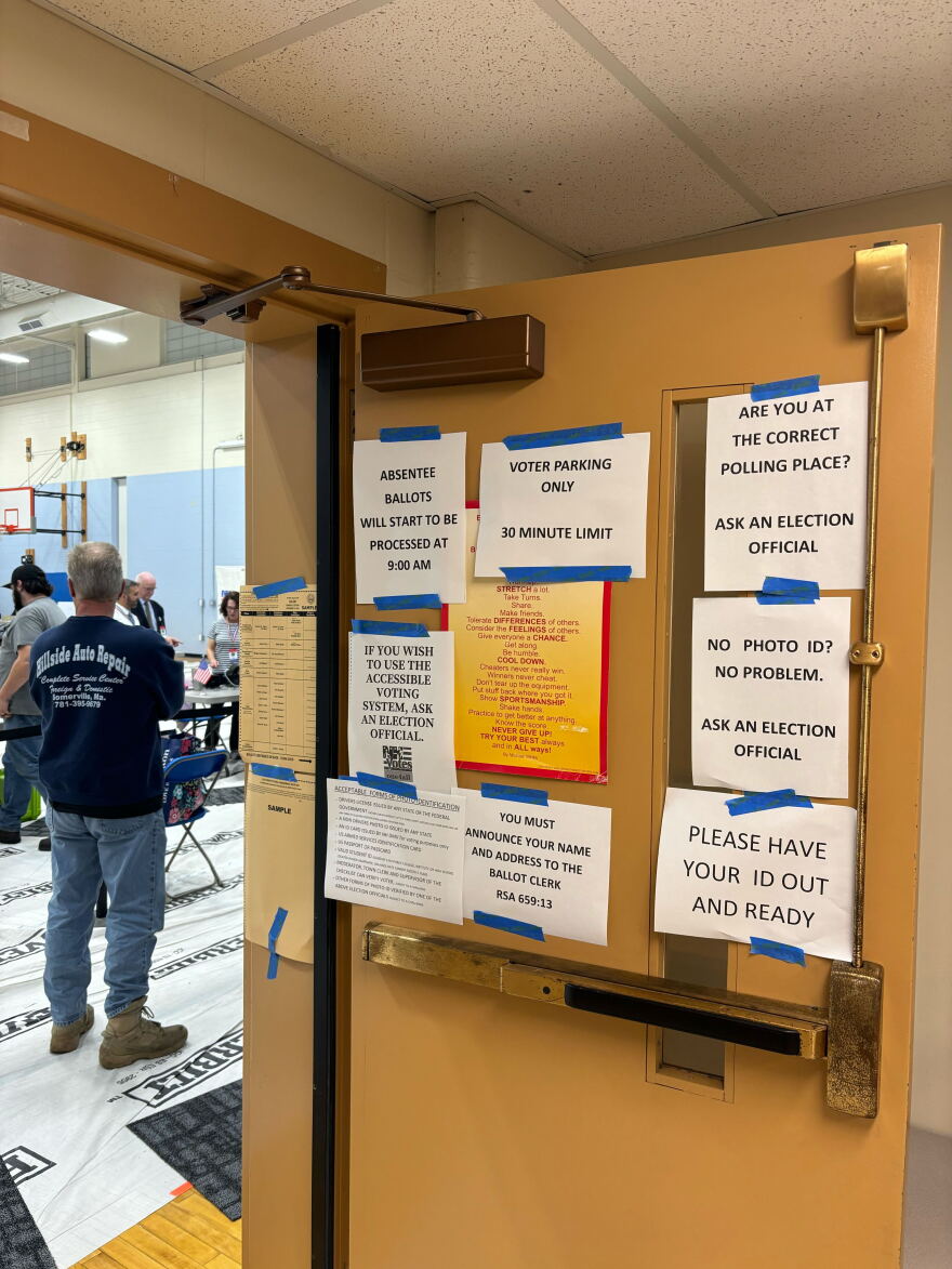 Signs with voter instructions adorn a door at North Salem Elementary School