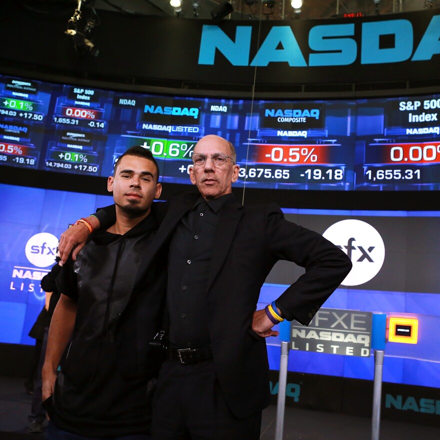 Producer and DJ Afrojack, left, with Robert F.X. Sillerman, in 2013. Sillerman was the co-founder and CEO of the now-defunct electronic dance music promotion company SFX, pictured here on the day it went public.