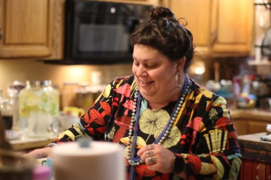 Amanda Calkins prepares tea for guests coming into her home for a sound bath workshop on Saturday, May 9.