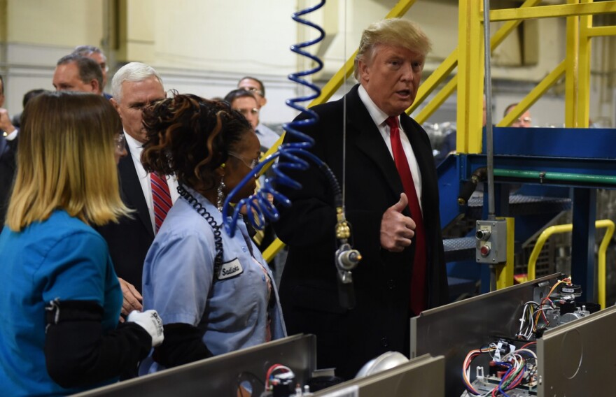 Then President-elect Donald Trump (right) and Vice President-elect Gov. Mike Pence visit the Carrier air conditioning and heating company in Indianapolis on Dec. 1, 2016.