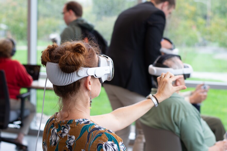An event attendee tries out the virtual reality experience.