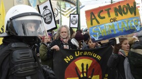 Climate activists stop in front of the COP24 UN Climate Change Conference venue during the March for Climate in a protest against global warming in Katowice, Poland, Saturday, Dec. 8, 2018.