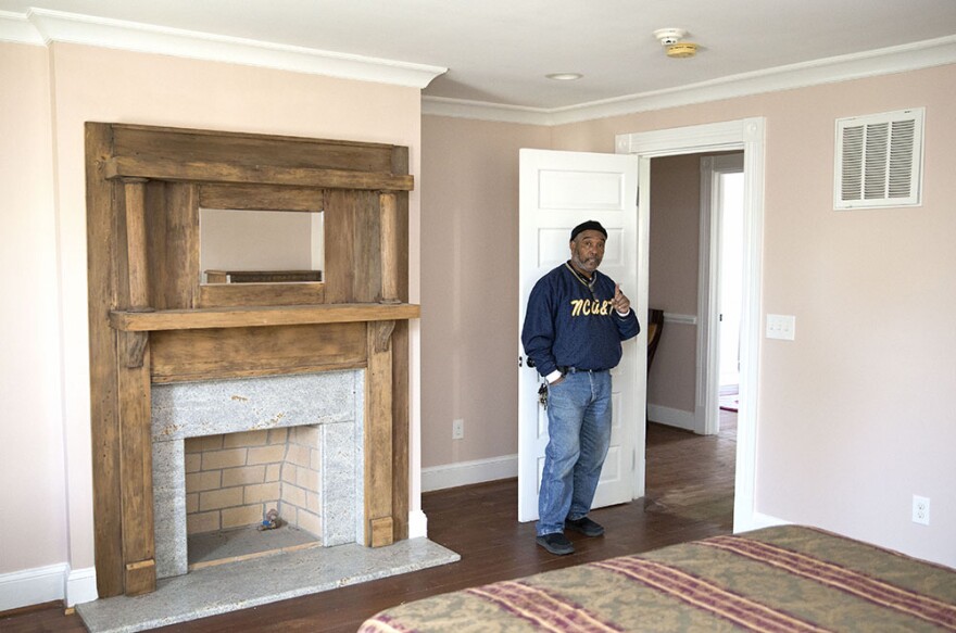 Sam Pass, owner of The Magnolia House on Gorrell Street in Greensboro, shows off an upstairs room he hopes to one day make a bed and breakfast. Pass brought back the historic motel from near destruction.