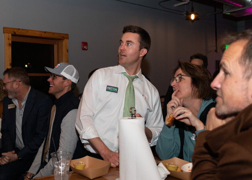 Republican candidate for the Illinois House Scott Preston, center, with fellow Normal Town Council member Kathleen Lorenz and other supporters Tuesday night in Uptown Normal.