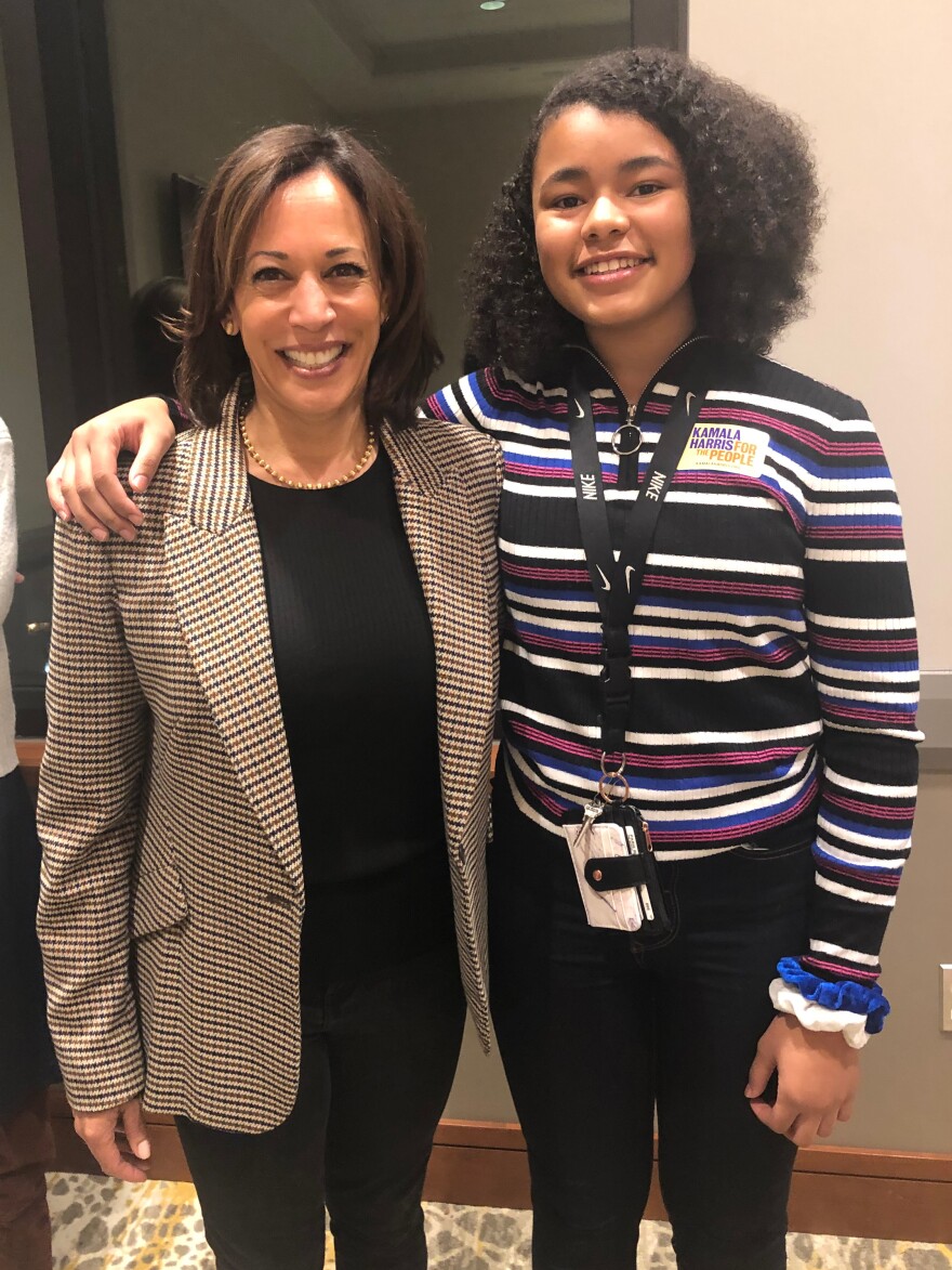 Harris poses with Paris Bond, then age 13, at a meeting of supporters in Muscatine, Iowa, last year.