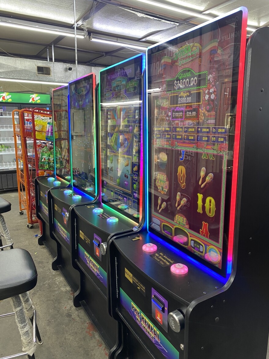Four games resembling slot machines are lined up in a west Louisville convenience store in September 2024.