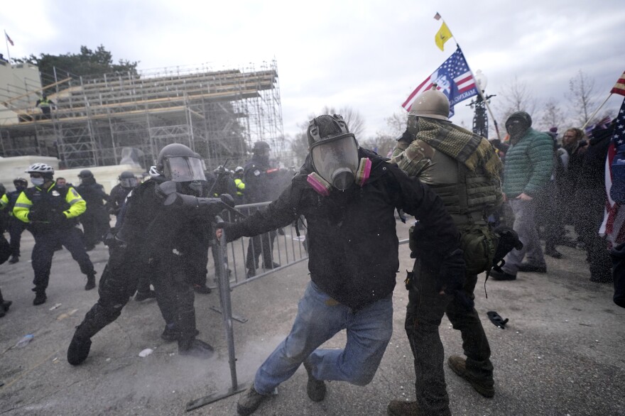 Trump supporters try to break through a police barrier during protests at the U.S. Capitol today, prompting U.S. Capitol Police to take further security measures.