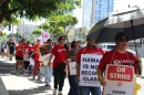 Kaiser Permanente workers represented by the Unite Here! Local 5 strike in Honolulu on Oct. 14, 2025.