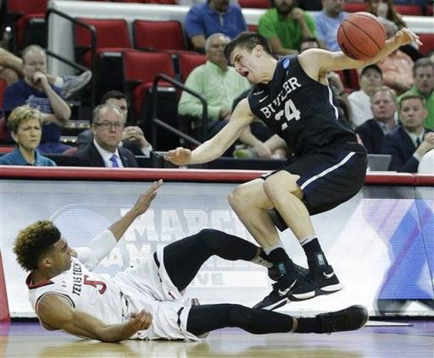 Butler guard Kellen Dunham (24) collides with Texas Tech forward Justin Gray (5) during a first-round men's college basketball game in the NCAA Tournament, Thursday, March 17, 2016, in Raleigh, N.C.