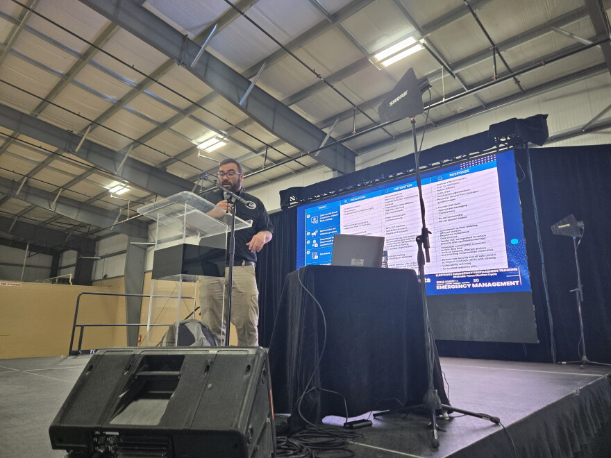Christopher Herrera, a specialist over training and exercise for the Bexar County Emergency Management Office, speaks during election volunteer training at an exhibit hall on the East Side rodeo grounds on Sept. 16, 2026