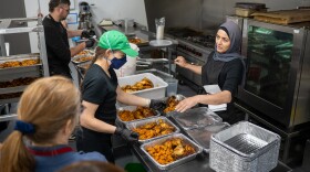 Volunteers prepared Thanksgiving meals for Cleveland's immigrant community who lost access to federal food supplements.