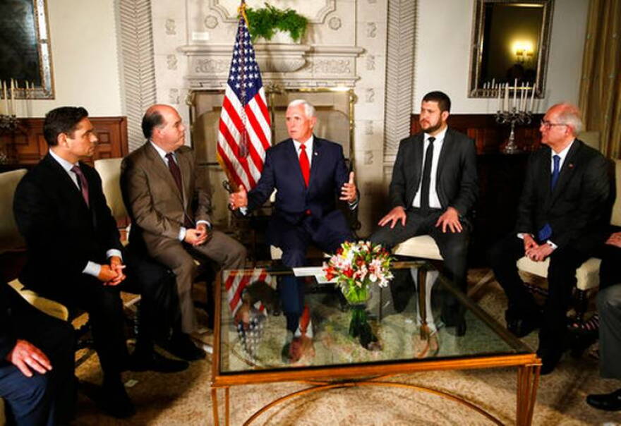 U.S. Vice President Mike Pence, center, speaks with Venezuelan opposition leaders, from left, Carlos Vecchio, Julio Borges, David Smolansky and Antonio Ledezma during a meeting at the residence of the U.S. ambassador in Lima, Peru, in April 2018.