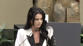Ashley LaChance addresses the Orange County Commission about regulating e-bikes and e-scooters on Tuesday, May 19, 2026. On Mother’s Day, a truck struck LaChance’s teenage son, Colton Remsburg, while he was riding an electric scooter. He later died from his injuries.