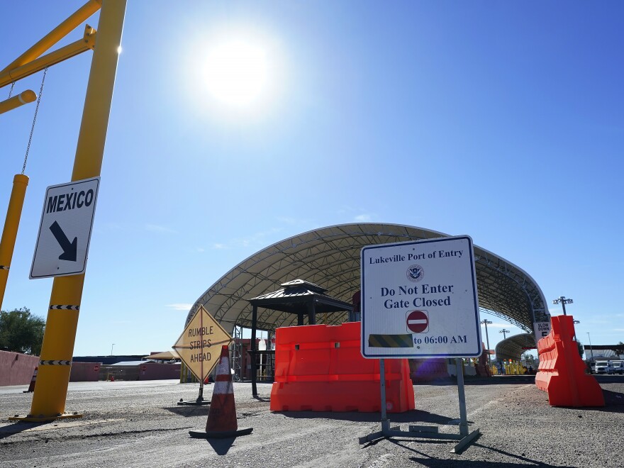 A sign shows the port of entry closed as thousands of migrants surge along the border Tuesday, Dec. 5, 2023, in Lukeville, Ariz.