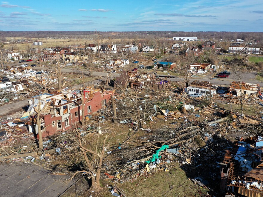 MAYFIELD, KENTUCKY - DECEMBER 11: In this aerial view, homes are badly destroyed after a tornado ripped through area the previous evening on December 11, 2021 in Mayfield, Kentucky. Multiple tornadoes touched down in several Midwest states late evening December 11 causing widespread destruction and leaving an estimated 70-plus people dead.   (Photo by Scott Olson/Getty Images)