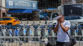A man uses a towel to cool down during an extreme heat wave that has broiled the East Coast, on Thursday, July 2, 2026, in New York. (AP Photo/Ryan Murphy)
