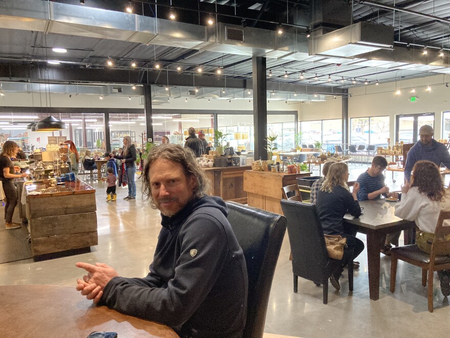 Bluecorn Beeswax owner Jon Kornbluh speaks to KVNF on opening day at Bluecorn Cafe and Mercantile in Montrose, March 30, 2022.