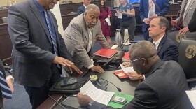 Council for Postsecondary Education President Aaron Thompson, Sen. Gerald Neal, Kentucky State University President Koffi Akakpo and Sen. Chris McDaniel (left to right) discuss Senate Bill 185 after it was passed out of committee in Frankfort.