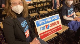 Spectators make their  positions known before a brief meeting outlining the Ohio Redistricting  Committee's next steps in redrawing legislative map districts in Ohio.  