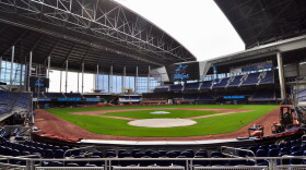 Workers prepare Marlins Park for the Marlins' 2019 opening day. The team hopes to rebuild trust with local fans in the effort to boost business.