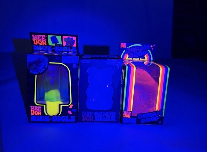 Neon accents on NeeDoh packaging