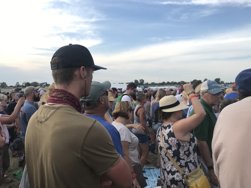 A concert goer at Railbird sports earplugs.