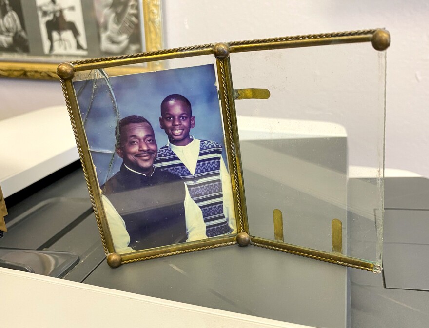 A photo that Melvin Bledsoe keeps at his office of him and his son.