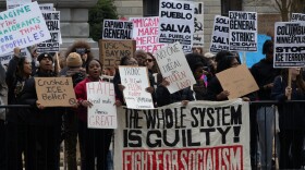 Protesters stand outside the Statehouse in Columbia Friday, Jan. 30.