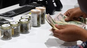 A customer pays for cannabis products at Essence Vegas Cannabis Dispensary in Las Vegas, Nevada.