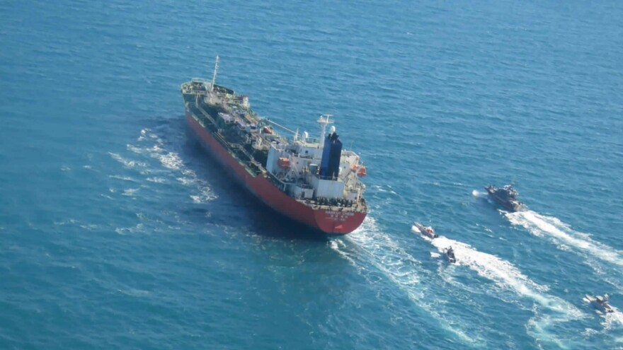 A seized South Korean-flagged tanker is escorted by Iranian Revolutionary Guard boats in the Persian Gulf, in a photo released Monday by Iran's Tasnim News Agency.