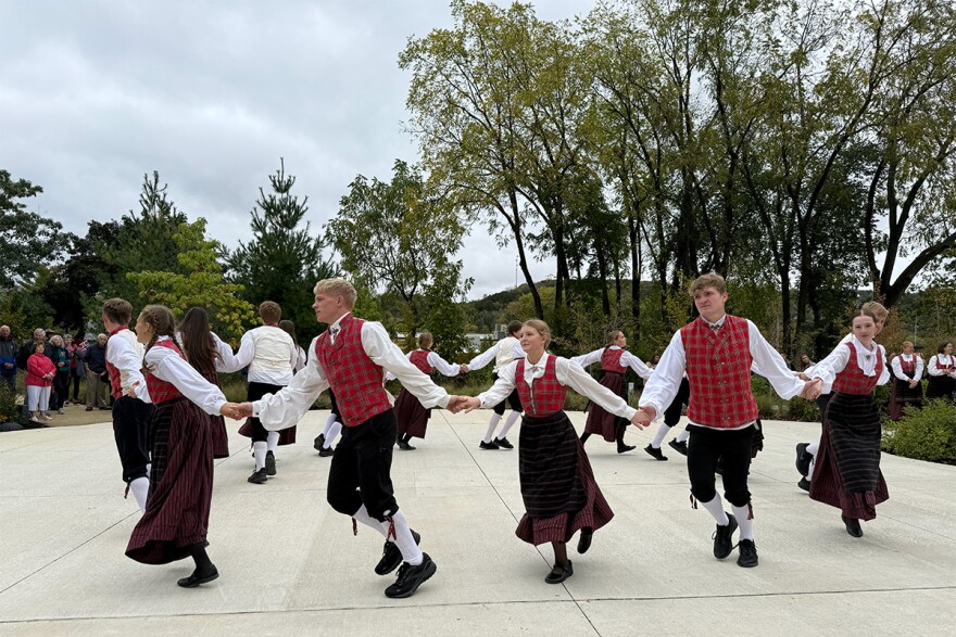 Dancers performed for the crown prince. The visit also featured folk demonstrators making Norwegian food and crafts.