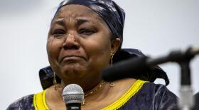 Patrick Lyoya's mother Dorcas Lyoya sheds tears during a news conference at the Renaissance Church of God in Christ Family Life Center in Grand Rapids, Mich. on Thursday, April 14, 2022. Civil rights attorney Ben Crump is representing the family of Patrick Lyoya, who was shot and killed by a GRPD officer on April 4.