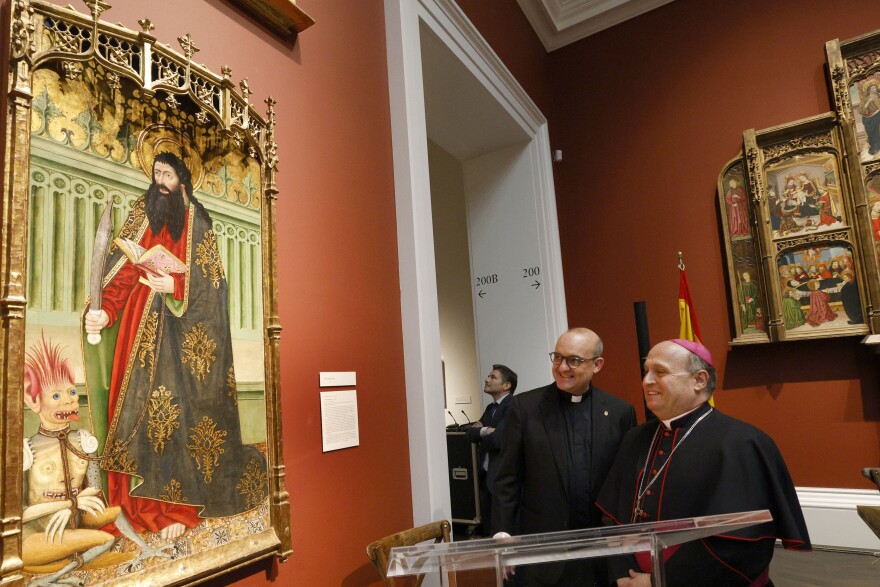 Manuel J. Formoso Fernández, dean-president of the Cathedral of Santiago de Compostela and vice president of Fundación Catedral de Santiago, left, and Archbishop of Santiago de Compostela Francisco José Prieto Fernández look at a painting together before a signing ceremony at the SMU’s Meadows Museum, Tuesday, Oct. 7, 2025, in University Park, to collaborate in a major exhibition coming to the museum in February 2027.