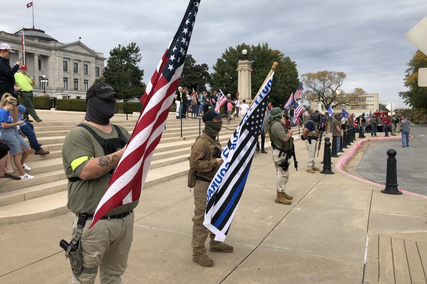 Armed supporters of President Trump demonstrate Saturday in front of the Arkansas state Capitol.