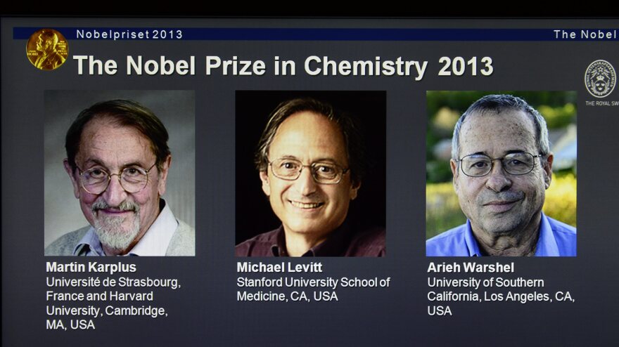 A screenshot of the Nobel Prizes webpage showing the 2013 chemistry laureates Martin Karplus, Michael Levitt and Arieh Warshel.