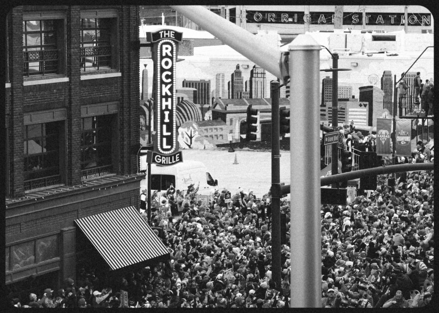  Throngs of fans outside the Rockhill Grille on Grand Boulevard in downtown Kansas City as the Chiefs victory parade goes past, on Feb. 15, 2023.
