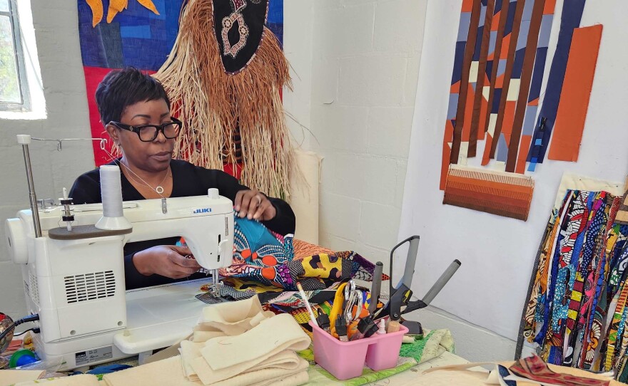 Artist Lisa Moore creates quilts reflective of Black history and culture in her studio at the Art and History Museums Maitland.