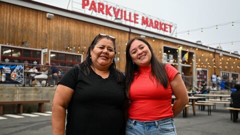 Fanny Puertas (L) owner of Mercado 27 in Parkville Market and her daughter Africa Vargas (R) stand outside in the courtyard of Parkville market in Hartford, Connecticut on July 15, 2026.